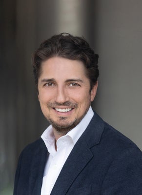 Portrait of Justin Lowe, Broker